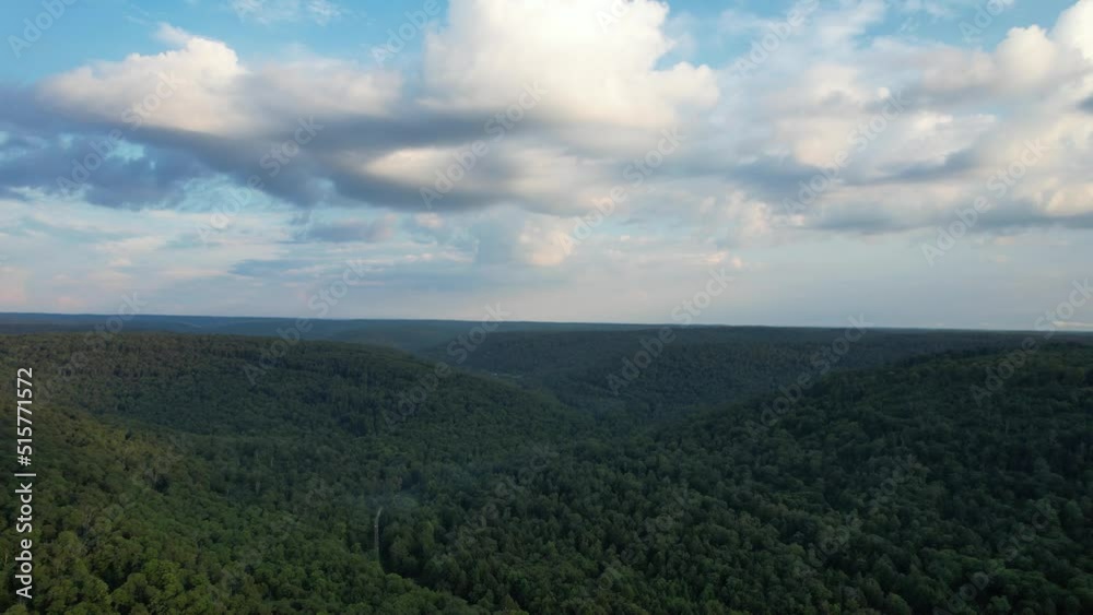 An aerial view of green hills with cloudy sky in the Allegheny National Forest An aerial view of green hills with cloudy sky in the Allegheny National Forest