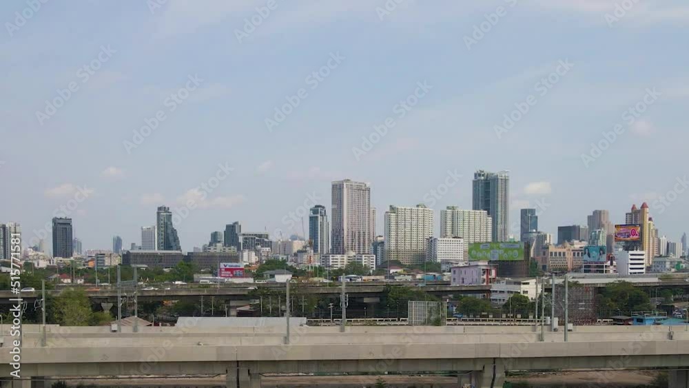 Bangkok skyline on sunny day, traffic at bridge, Famous destination, Thailand. Aerial Sideways views Bangkok skyline on sunny day, traffic at bridge, Famous destination, Thailand. Aerial Sideways views