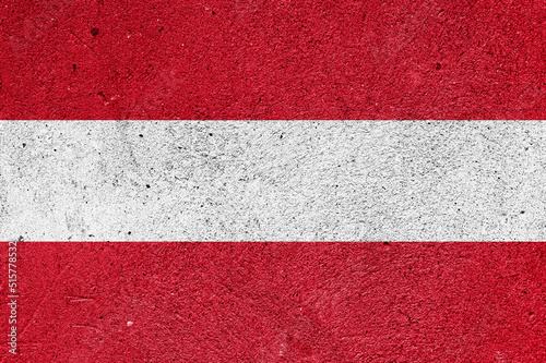 Austrian national flag on a plaster wall