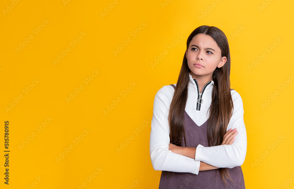 sad child with long hair on yellow background sad child with long hair on yellow background