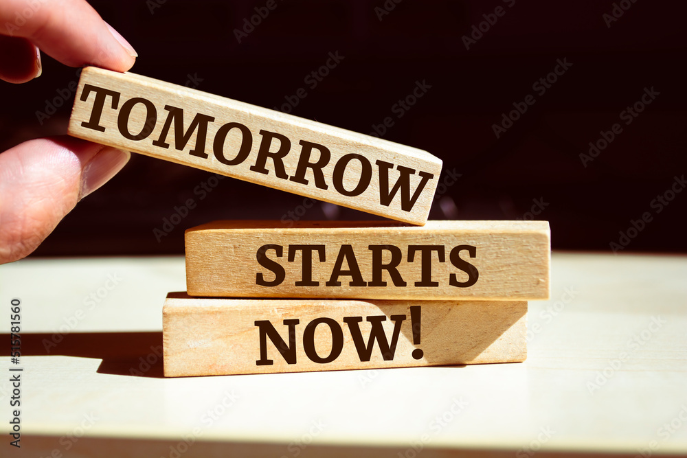 Wooden blocks with words 'Tomorrow Starts Now'. Wooden blocks with words 'Tomorrow Starts Now'.