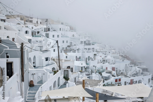 The famous and picturesque village of Imerovigli in Santorini covered in a cloud