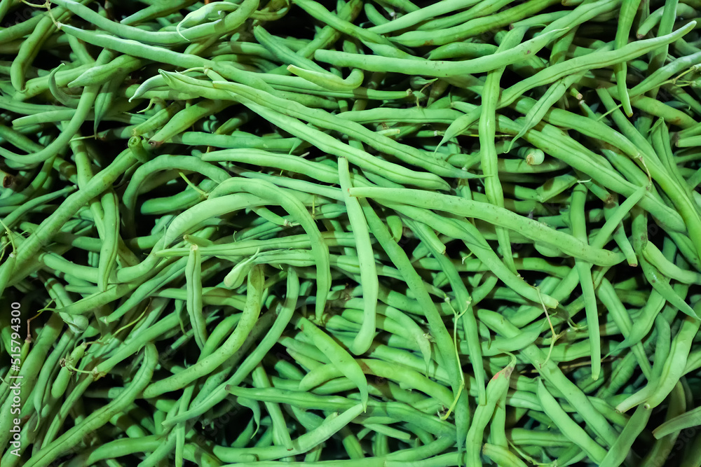 Green and white fresh pod peas are sold at the farmer's market