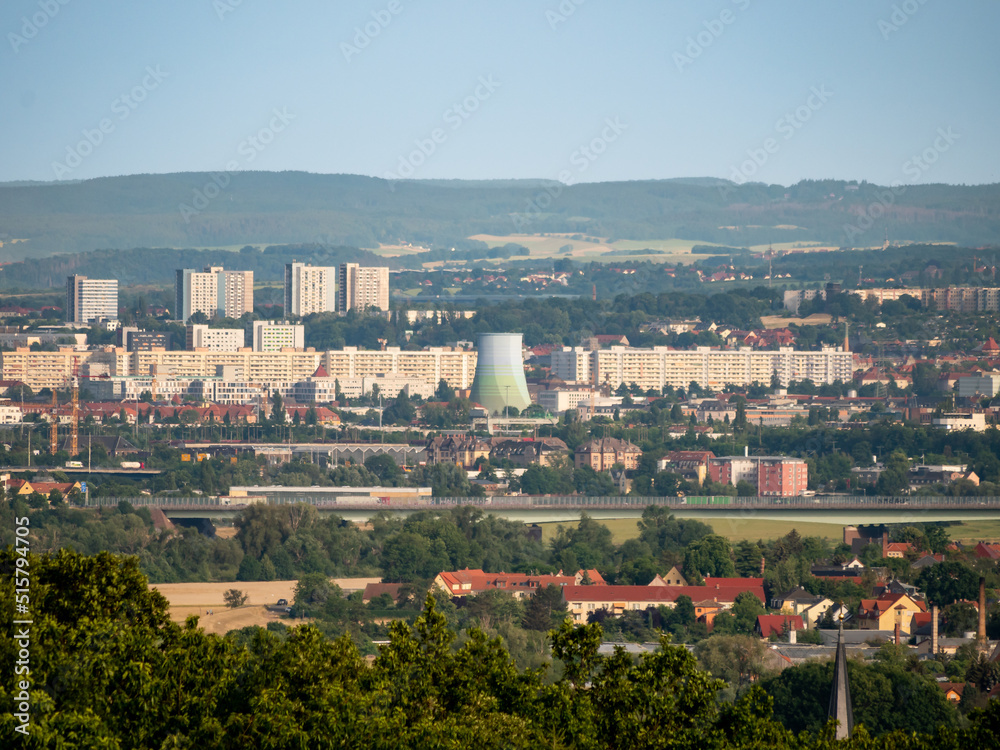 Cityscape of Dresden in Saxony. View into the inner city with a lot of huge residential buildings for many people. The big cooling tower of the local energy provider stands out.