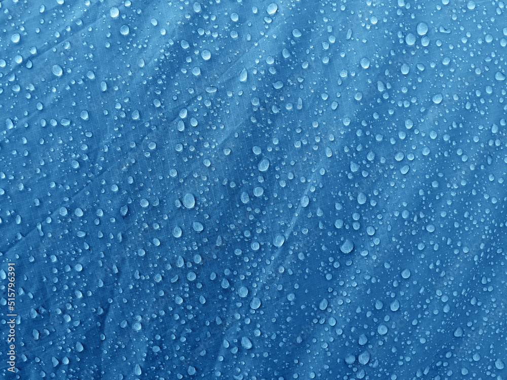 Obraz premium Water drops on waterproof membrane fabric. Morning dew on tent.