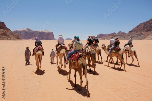 Canvas-taulu Trip on camels on Wadi Rum Desert in Jordan