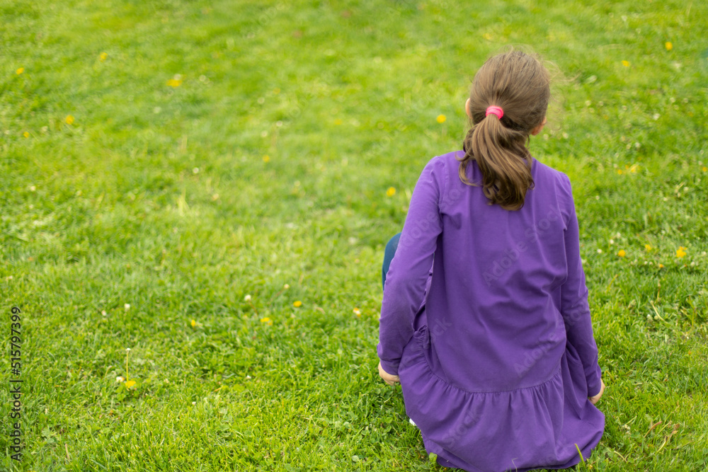 Child on green grass. Schoolboy plays on lawn in summer. Active holidays. Child on green grass. Schoolboy plays on lawn in summer. Active holidays.