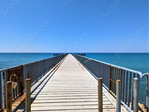 wooden bridge in the sea © Zhanna