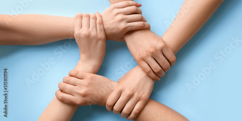 People holding hands togeth...