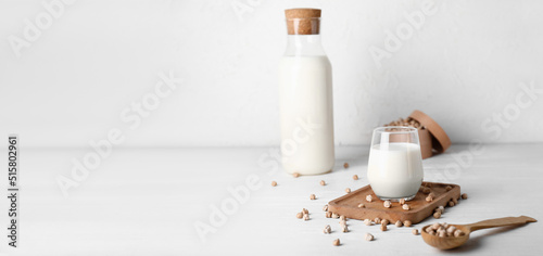 Tasty chickpea milk on light background with space for text