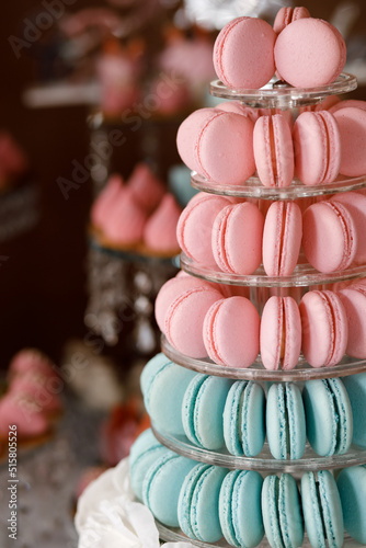 a mountain of pink and turquoise macaroons on the festive table
