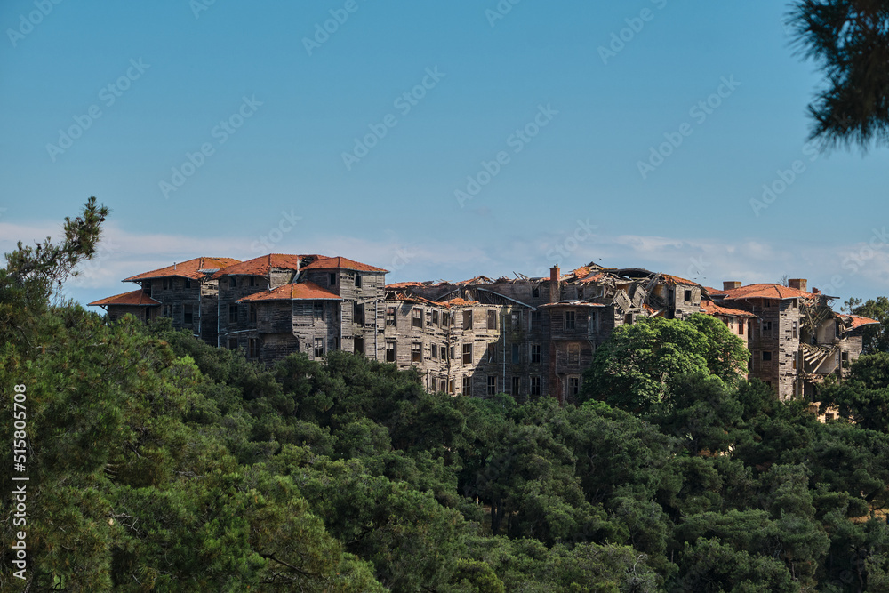 Prinkipo Greek Orthodox Orphanage wide view from hill, abandoned and brownfield biggest wooden made building