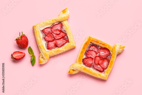 Delicious strawberry puff pastry on pink background