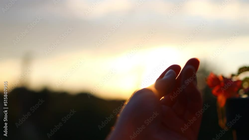 Sunset between the hands of girl. Happy girl stretches out her hand to the sun. Happy family concept. High quality 4k footage Sunset between the hands of girl. Happy girl stretches out her hand to the sun. Happy family concept. High quality 4k footage