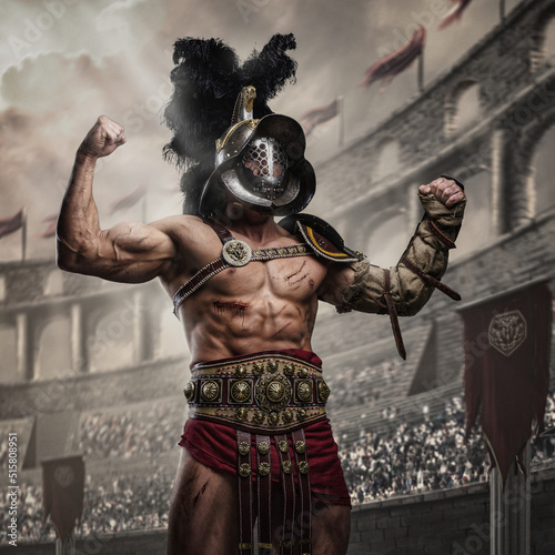 Shot of gladiator winner dressed in armor and helmet posing for crowd in arena.