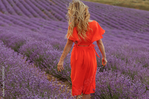 Fototapeta Naklejka Na Ścianę i Meble -  Young beautiful blonde woman in lavender field