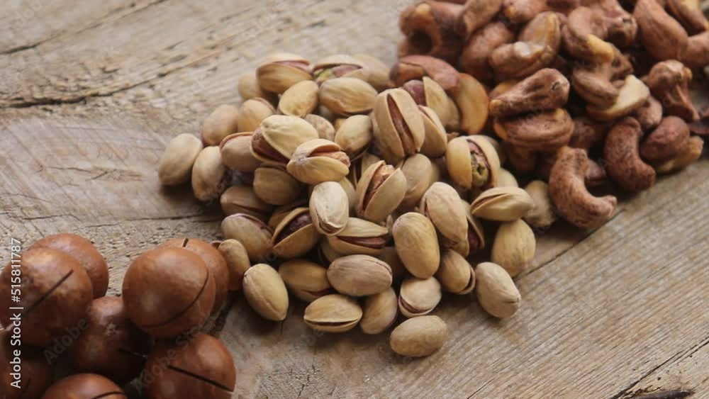 pistachio nuts on wooden background