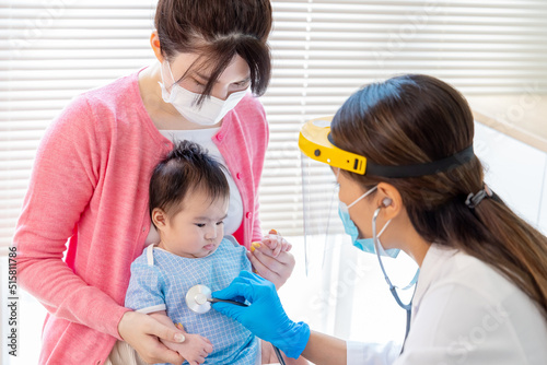 asian doctor examine baby health