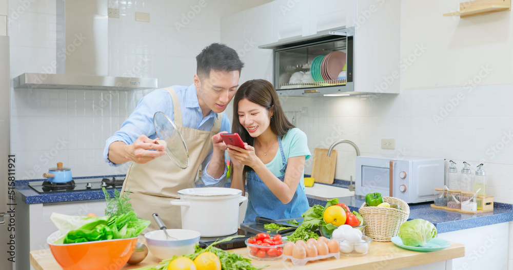 young couple are cooking together