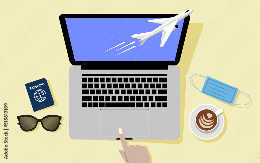 desk with laptop, passport, coffee, mask, ready to travel desk with laptop, passport, coffee, mask, ready to travel
