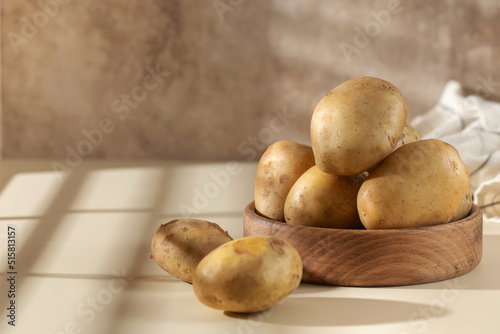 Raw potatoes in a bowl. The concept of harvesting  organic food.