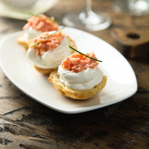 Homemade profiteroles with salmon and cream cheese