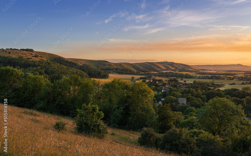 Fototapeta premium Beautiful views west over the village of Poynings from Devils Dyke to Chanctonbury ring on the south downs in west Sussex south east England UK