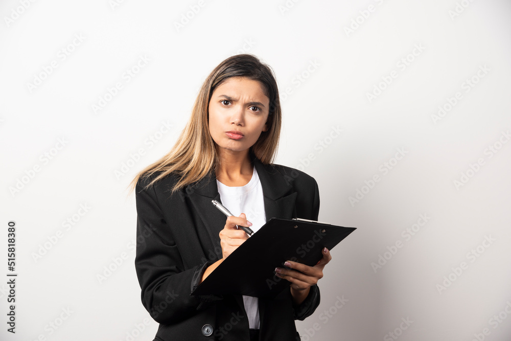 Business woman holding document on clipboard Business woman holding document on clipboard