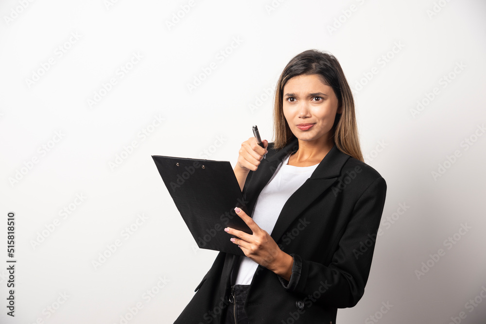 Young business woman holding clipboard Young business woman holding clipboard