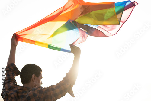 Happy man with a pride flag. LGBT community.