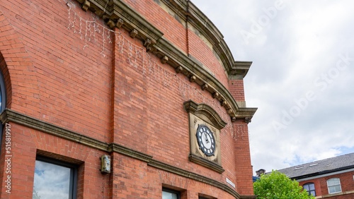 Part of the 19th century building with a clock