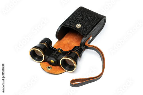 Vintage binoculars with leather case isolated on white background