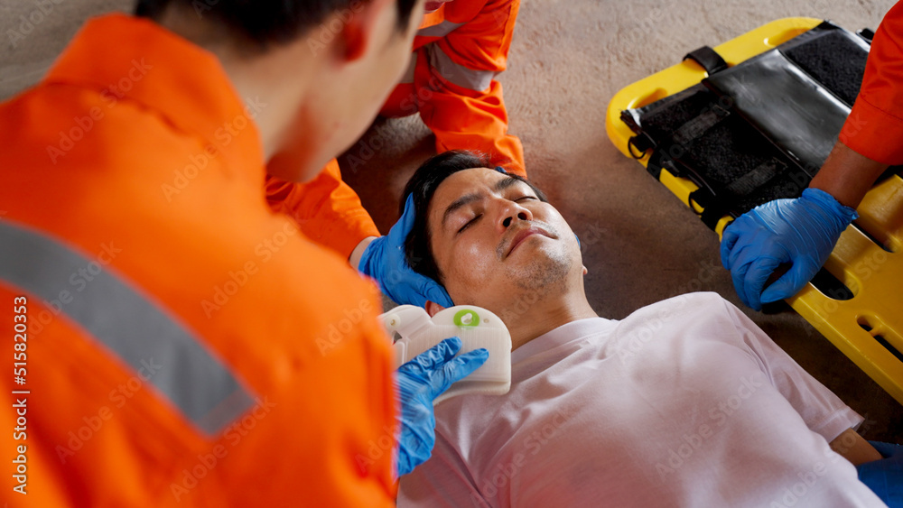 Asian emergency medical technician (EMT) or paramedic team is holding  manual stabilization of the head patients and wearing neck collar,  Emergency medical services (EMS) nurses concept Photos | Adobe Stock