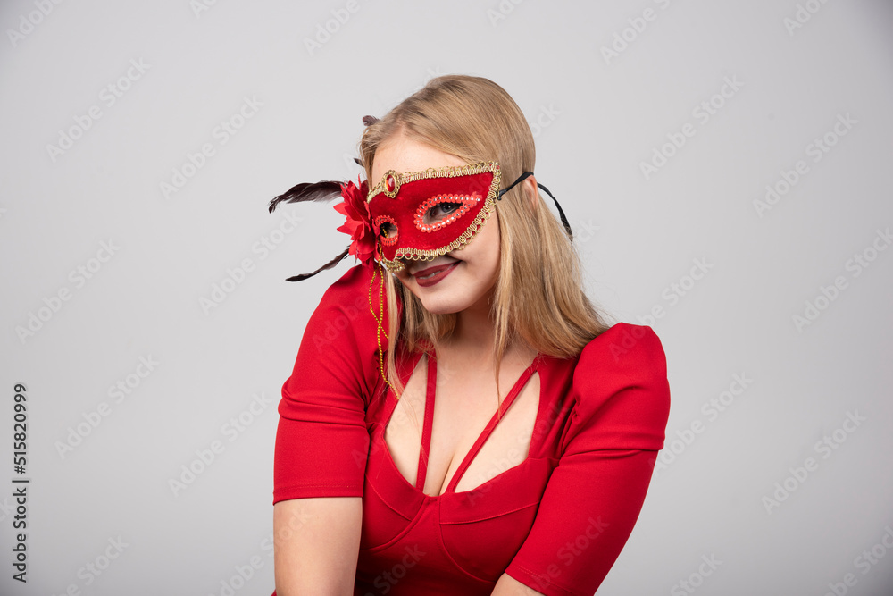 Beautiful blond Woman in a Carnival masquerade mask Beautiful blond Woman in a Carnival masquerade mask