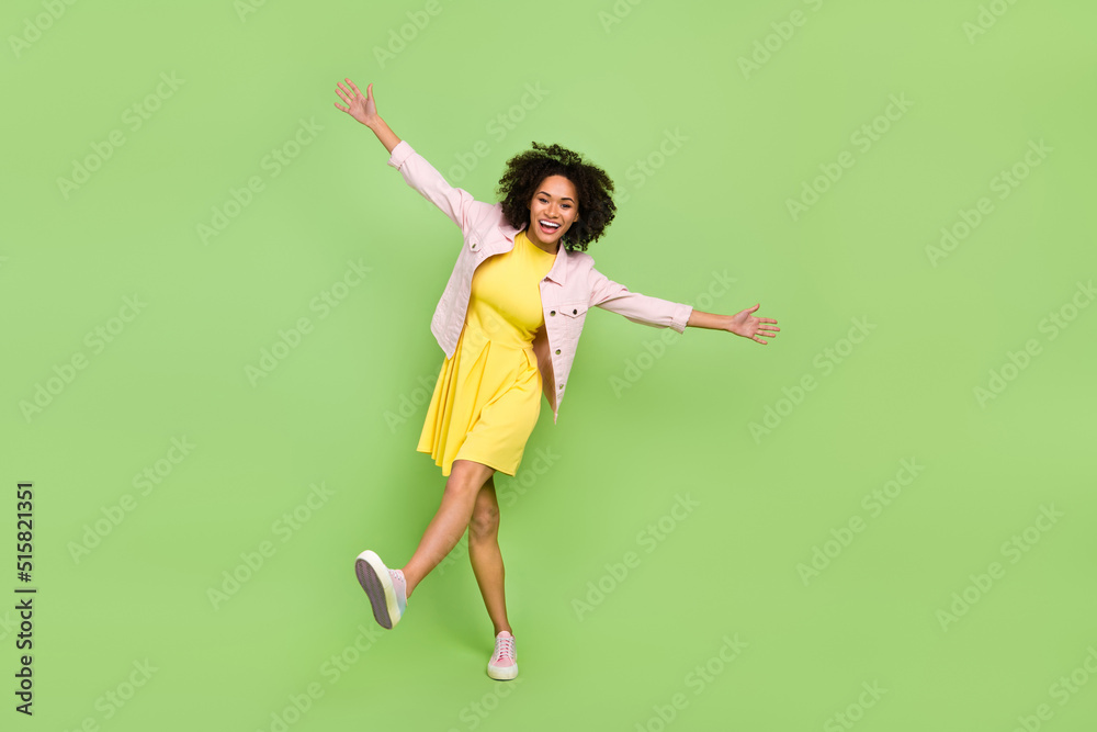 Full size photo of good mood charming female dancing relaxing on summer season vacation isolated on green color background