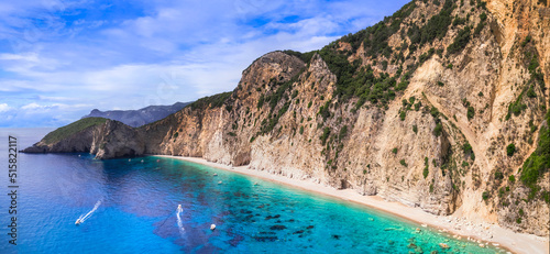 Fototapeta Naklejka Na Ścianę i Meble -  Greece, Ionian islands. Best beaches of Corfu.  impressive Paradise beach and Stelaris beach under huge rocks. aerial drone view