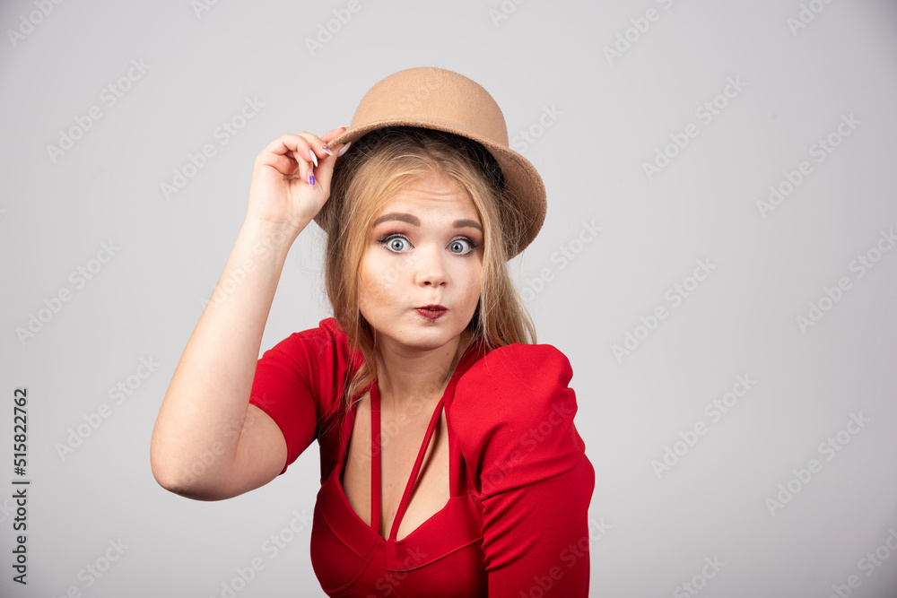 Young beautiful woman in red dress looking at front Young beautiful woman in red dress looking at front