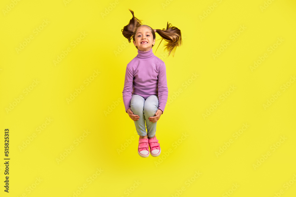 Full size photo of lovely pretty kid girl jumping high isolated vivid bright color background
