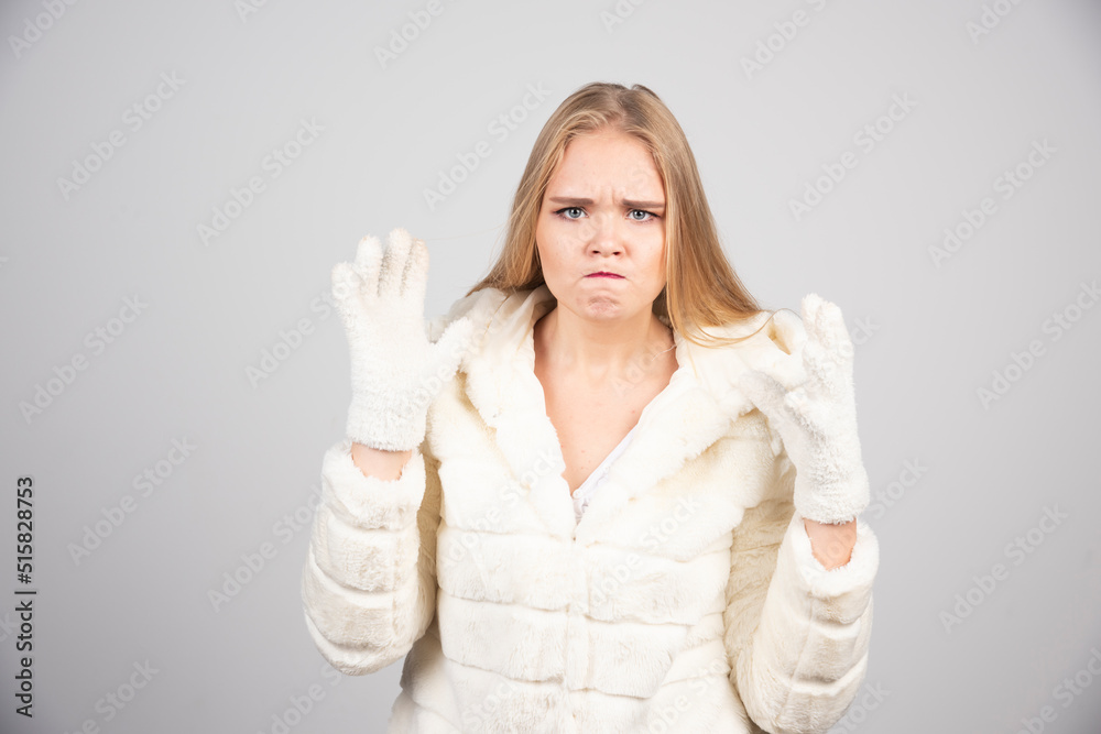 Beautiful woman in winter outfit looking angry Beautiful woman in winter outfit looking angry
