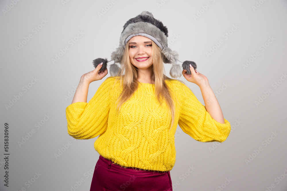 Beautiful woman in winter hat smiling Beautiful woman in winter hat smiling