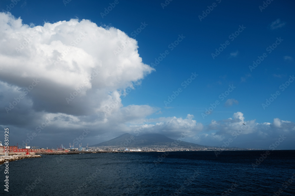 Beautiful view of Mount Vesuvius with a huge white cloud over the city of Naples, Mediterranean sea, Napoli, Italy