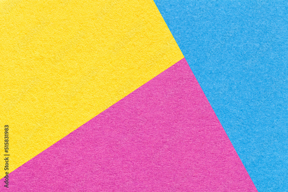 Fototapeta premium Texture of craft yellow, blue and purple shade color paper background. Structure of abstract magenta cardboard