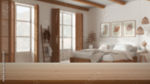 Empty wooden table  desk or shelf with blurred view of romantic country bedroom with double bed and windows with shutters  parquet   modern interior design concept