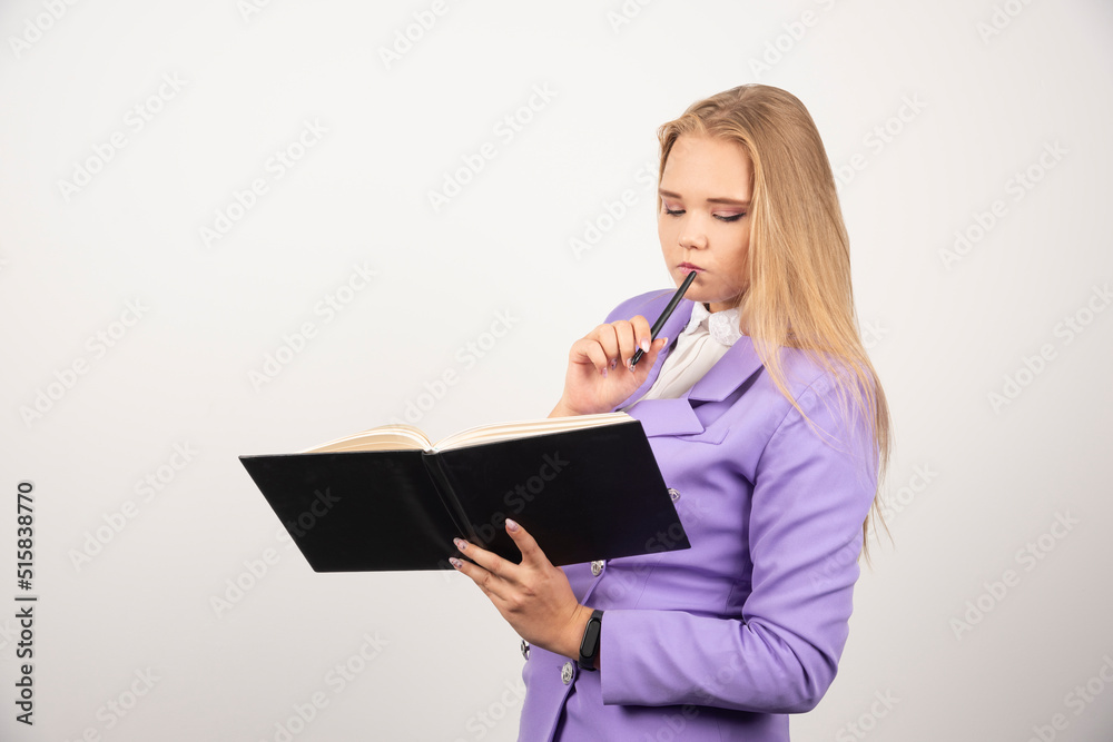 Woman looking on opened tablet on white background Woman looking on opened tablet on white background