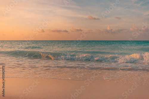 Fototapeta Naklejka Na Ścianę i Meble -  Closeup sea sand beach. Panoramic beach landscape. Inspire tropical beach seascape horizon. Orange and golden sunset sky calmness tranquil relaxing sunlight summer mood. Vacation travel holiday banner