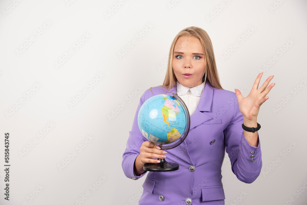 Female teacher holding with shocked expression Female teacher holding with shocked expression