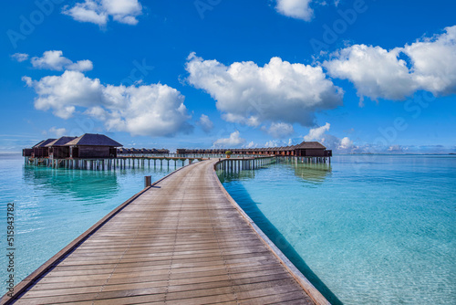 Maldives paradise background. Tropical aerial landscape, seascape with long pier, water villas, amazing sea sky and lagoon beach, tropical nature. Exotic tourism destination banner, summer vacation