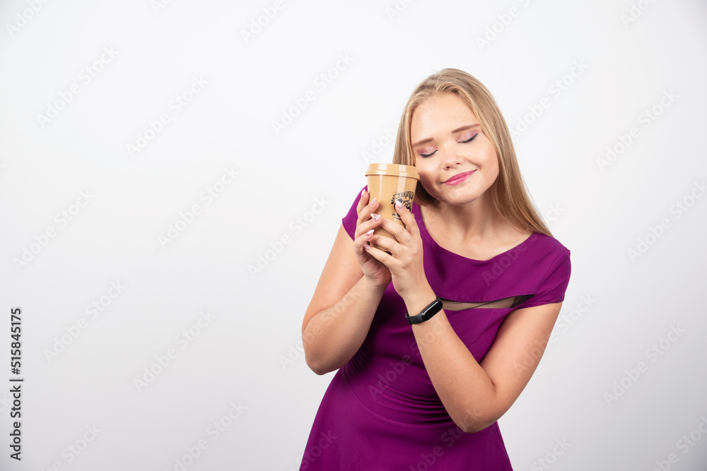 Elegant woman with cup of coffee posing Elegant woman with cup of coffee posing