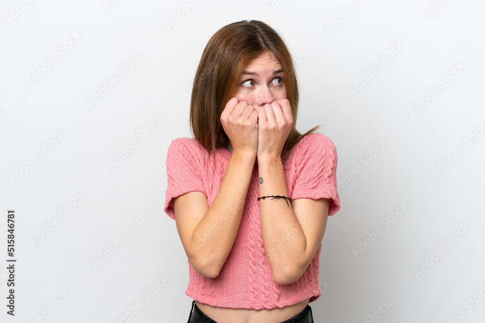 Young English woman isolated on white background nervous and scared putting hands to mouth Young English woman isolated on white background nervous and scared putting hands to mouth