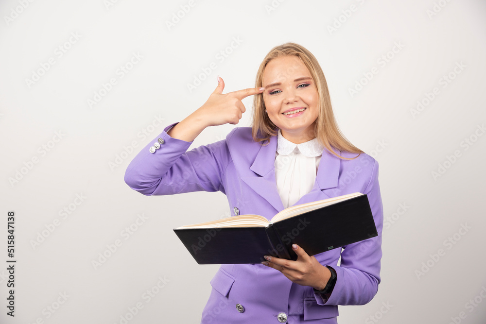 Young woman with opened tablet on white background Young woman with opened tablet on white background